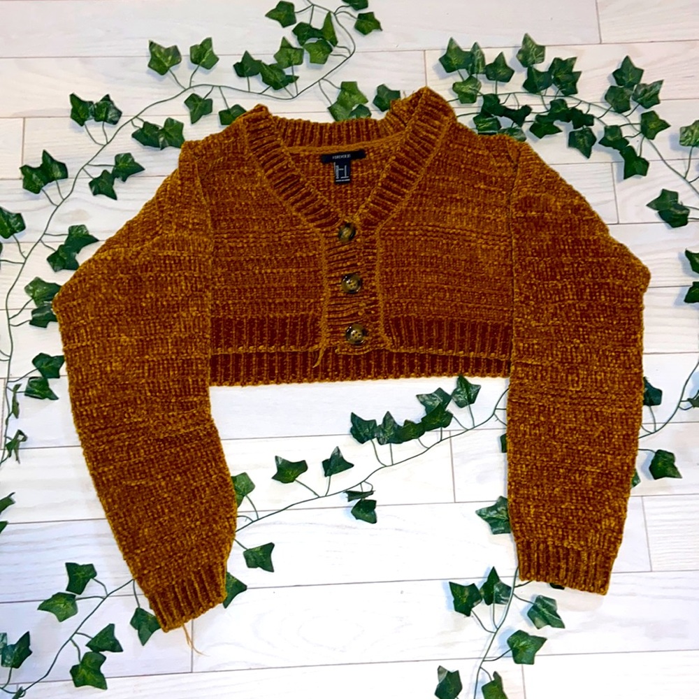 extremely fuzzy material with a yellow mustard pretty colored button up sweater